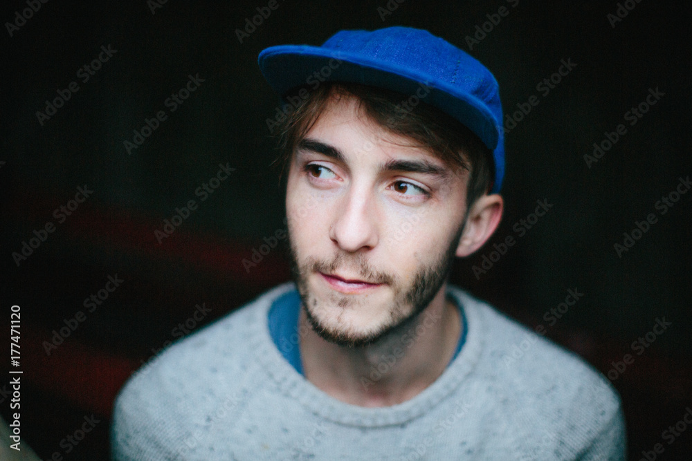 Portrait of a young man in a blue hat Portrait of a young man in a blue hat