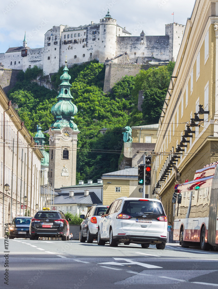 Cars in a row waiting at traffic light on street of Salzburg, Austria