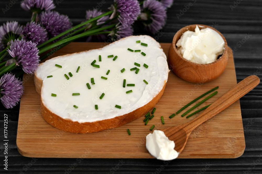 Cream cheese and chives on slice of bread Cream cheese and chives on slice of bread