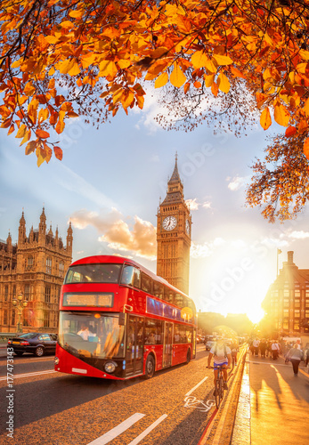 Buses with autumn leaves against Big Ben in London, England, UK