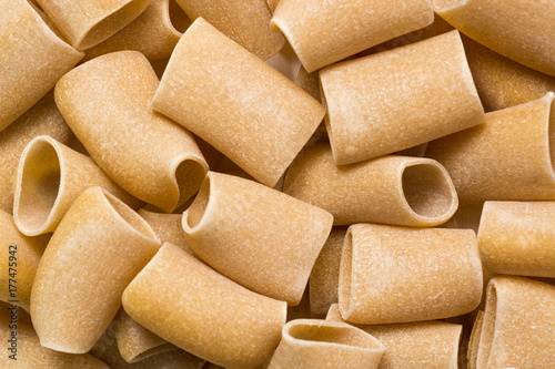 composition of Italian raw Paccheri Pasta.   photo