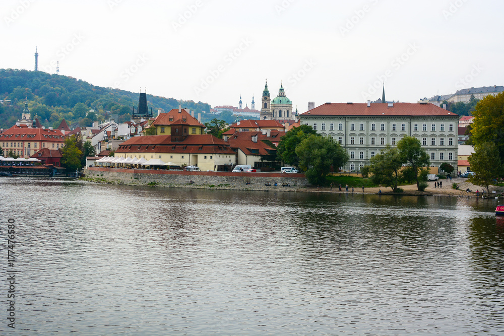 Cityscape of Prague, Czech Republic. Vltava river, Old Town and Church of Saint Nicholas at Mala Strana 
