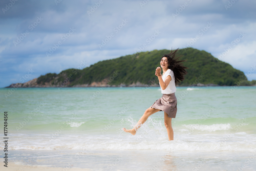 Beautiful Asian woman vacation on beach of Thailand Beautiful Asian woman vacation on beach of Thailand