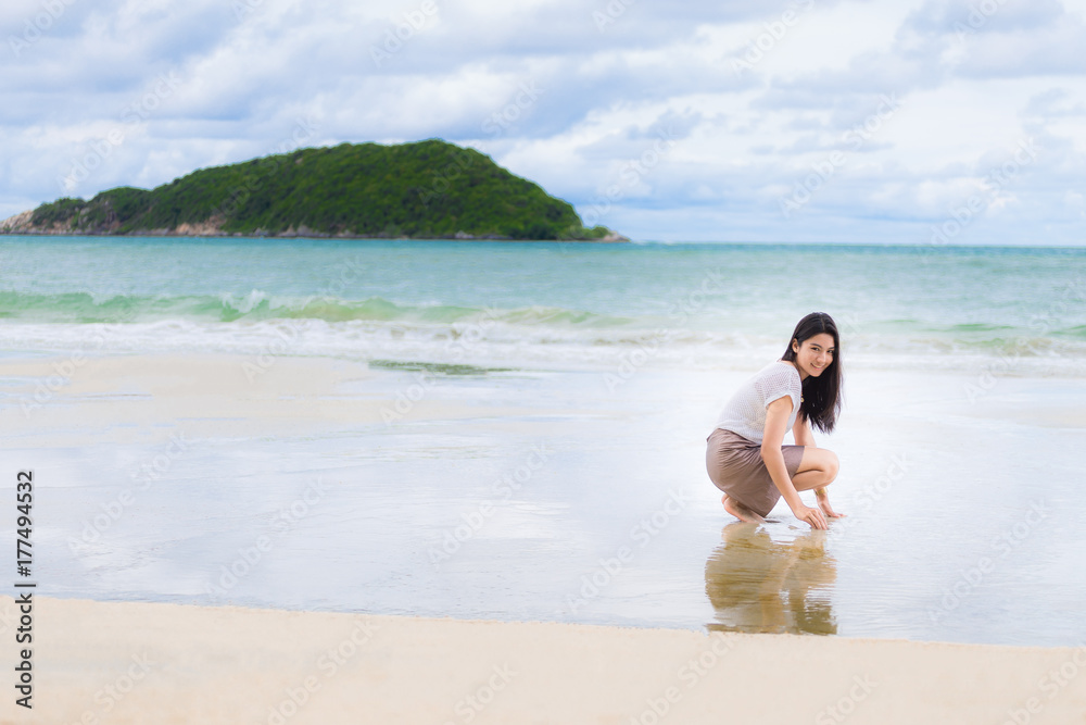 Beautiful Asian woman vacation on beach of Thailand Beautiful Asian woman vacation on beach of Thailand