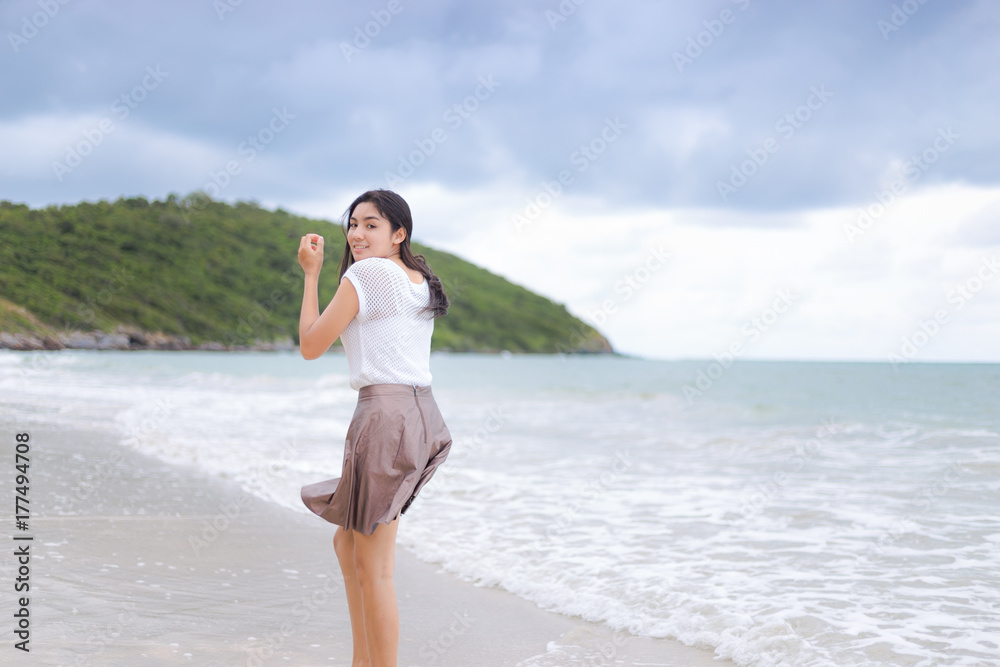 Beautiful Asian woman vacation on beach of Thailand Beautiful Asian woman vacation on beach of Thailand