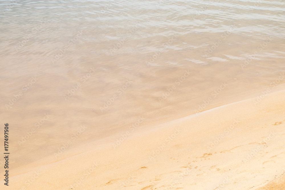 Calm wave and sand