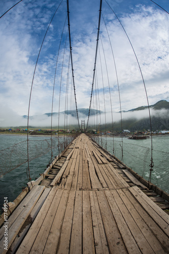 Trift Bridge is the longest pedestrian-only suspension bridge at the foot of the Belukha mountain  Altai Mountains  Russia