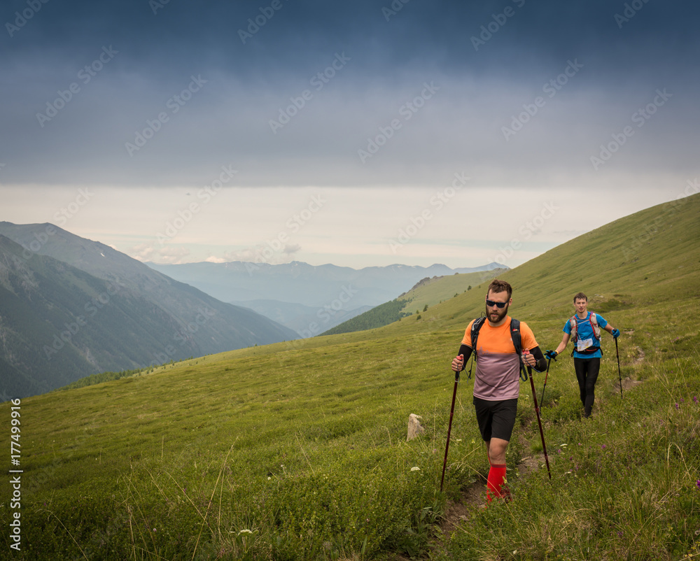 Man trail running in the mountain in Altai, Russia