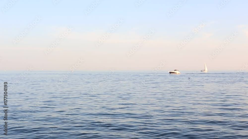 Toronto, ON, Canada - September 23, 2017 - short video of sunset on Lake Ontario with sailboat speedboats and jetskies Toronto, ON, Canada - September 23, 2017 - short video of sunset on Lake Ontario with sailboat speedboats and jetskies