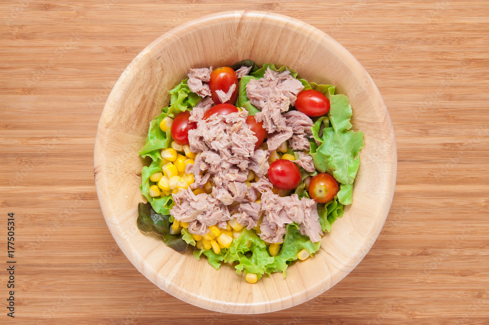 Tuna salad in bowl on wooden table. Tuna salad in bowl on wooden table.