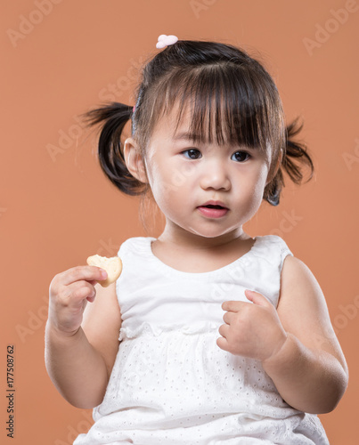 Little girl eating snack