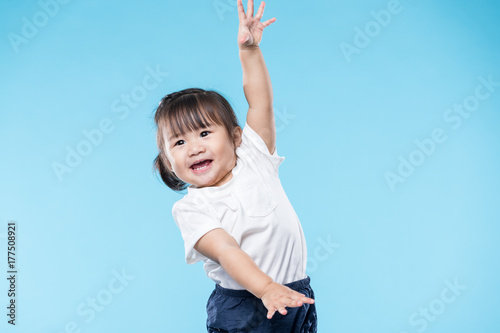 Baby girl raise hand up