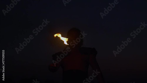 Fantastic Show at Sunset. Circus artist Spit the Fire in slow motion.