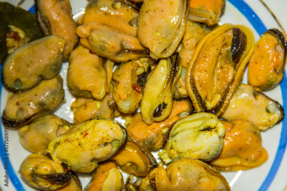 Tasty pickled mussels on a plate Tasty pickled mussels on a plate