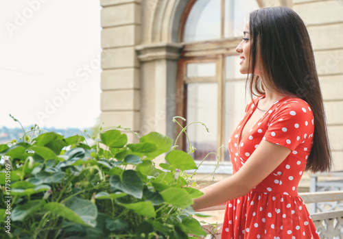 Young beautiful lady near p...