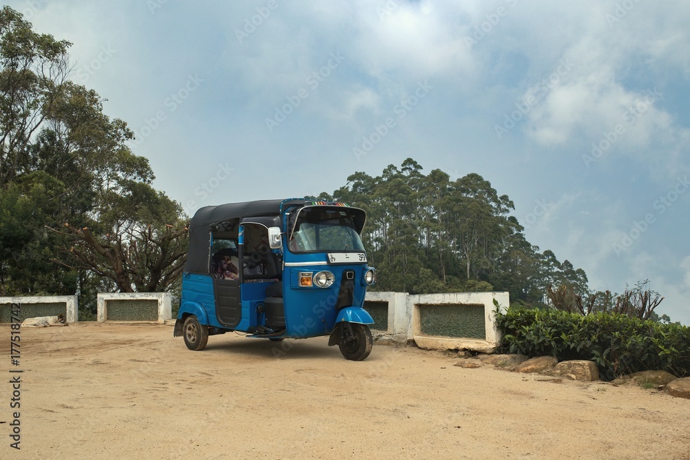 A means of transport called the TUK TUK at the top of the hill, called 