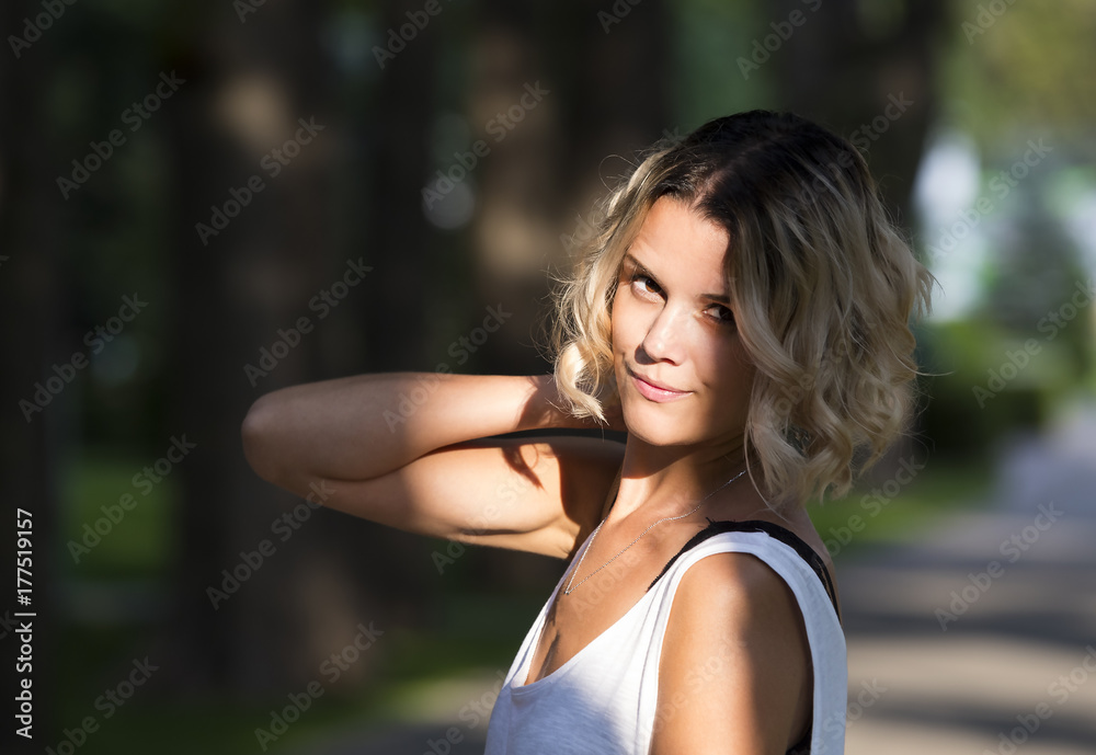 Portrait of a girl in a summer park outdoors Portrait of a girl in a summer park outdoors