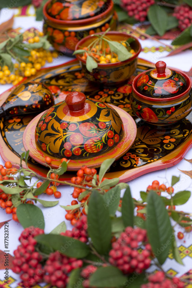 khokhloma dishes autumn patterns Russian color folk craft berry leaves red yellow