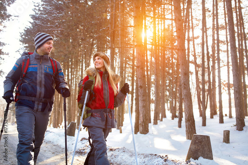 Love couple hiking on winter photo