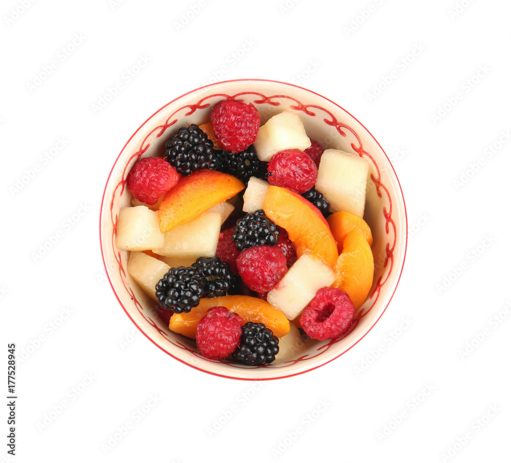 Bowl with delicious fruit salad on white background Bowl with delicious fruit salad on white background