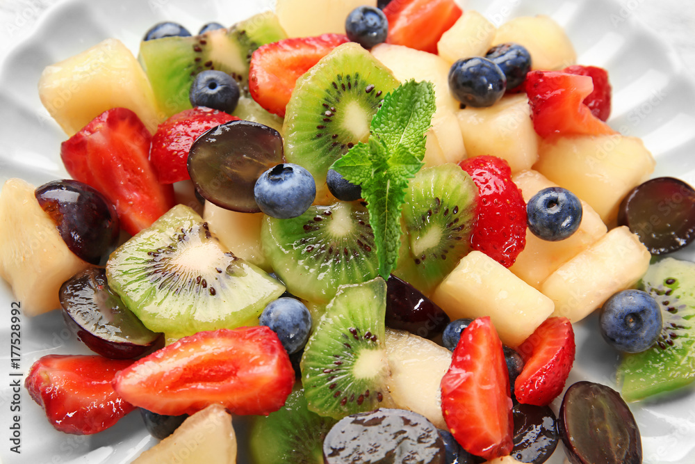 Plate with delicious fruit salad, closeup Plate with delicious fruit salad, closeup