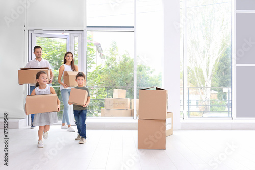 Happy family with moving bo...