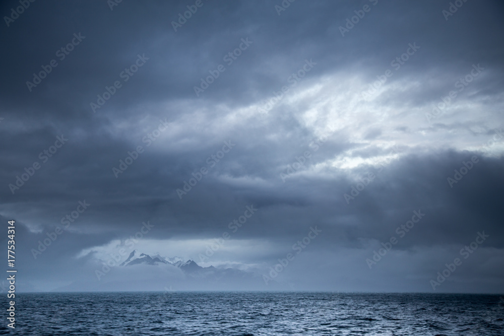 The mountains of South Georgia appear through the clouds. The mountains of South Georgia appear through the clouds.