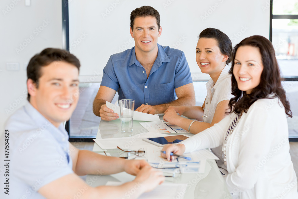 Image of business partners discussing documents and ideas Image of business partners discussing documents and ideas