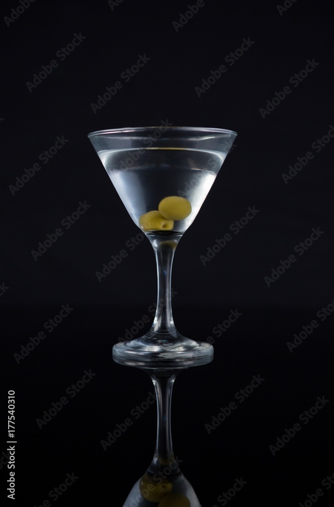 Cocktail martini with olives on table Cocktail martini with olives on table