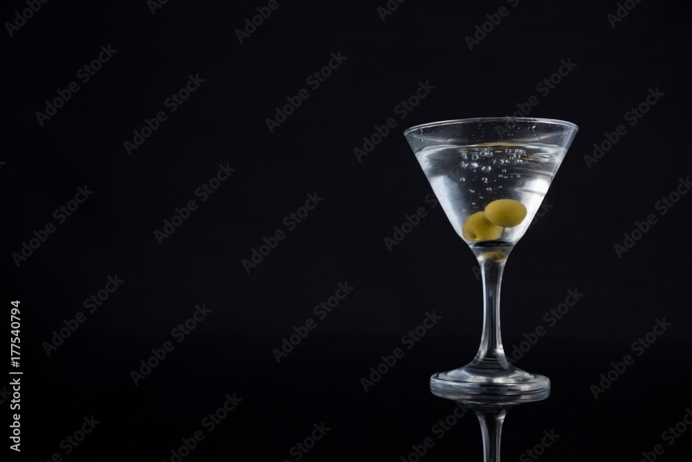 Cocktail martini with olives on table Cocktail martini with olives on table