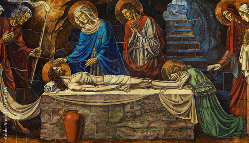 Jesus Christ lying death in his grave, with his mother Mary