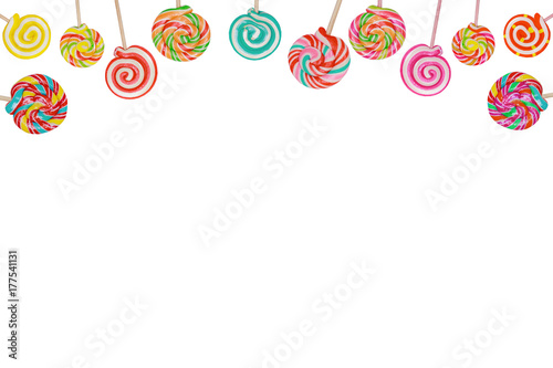 Rainbow candy lollipop on stick isolated in white.
