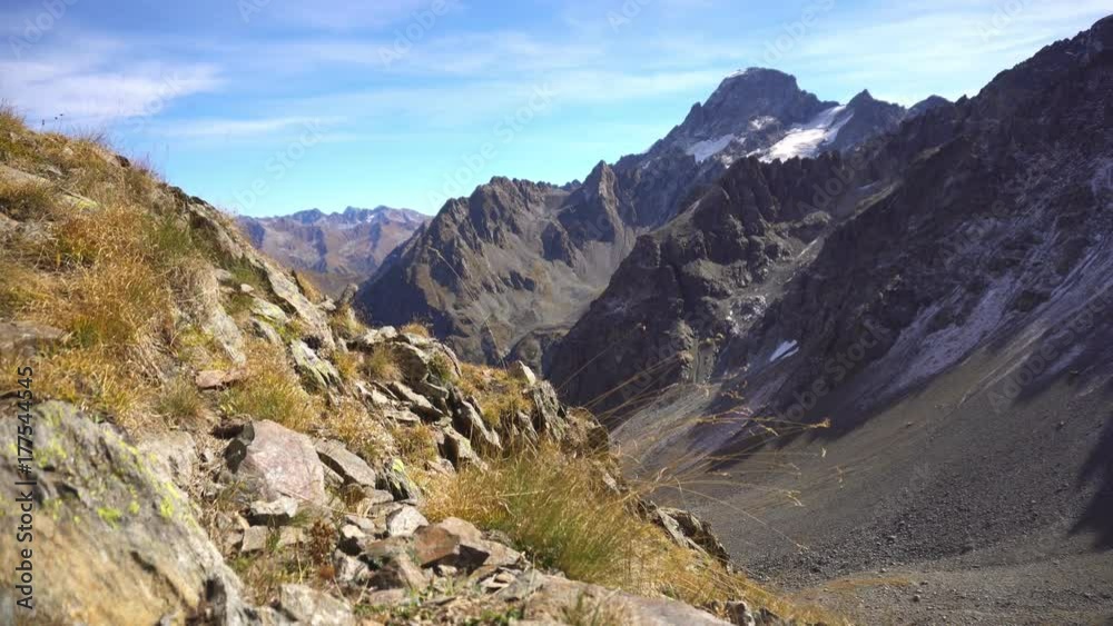 Mountain alpine landscape with grass. Mountains peaks Mountain alpine landscape with grass. Mountains peaks