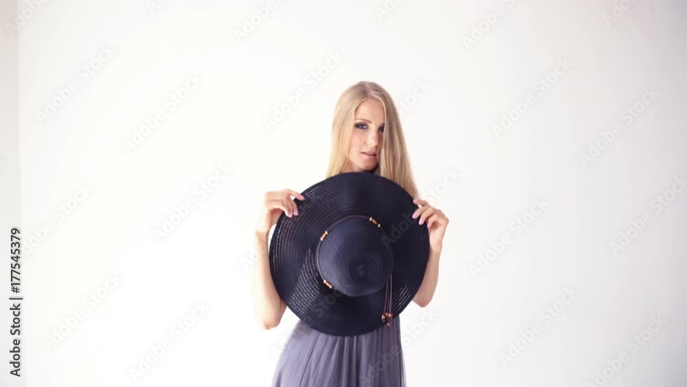 beautiful girl with a hat with a brim smiles flirts beautiful girl with a hat with a brim smiles flirts