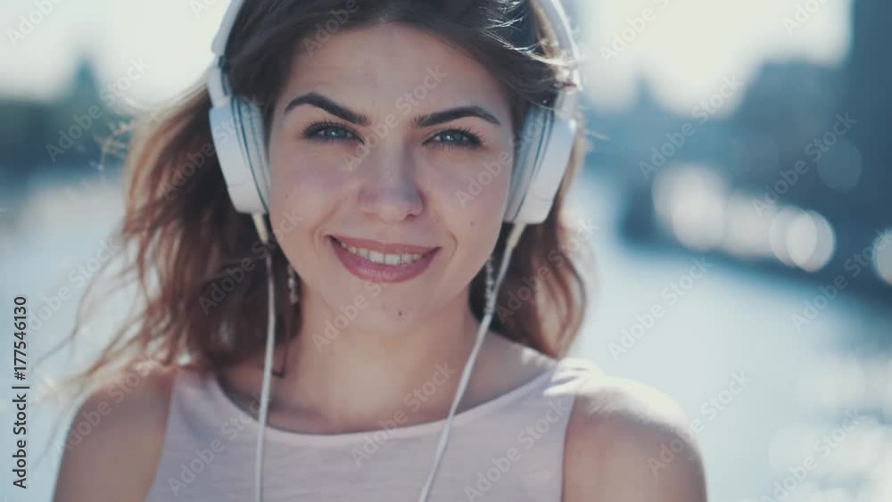Happy girl with a headphones outdoors Happy girl with a headphones outdoors