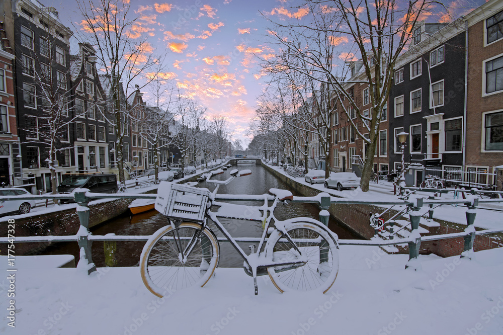 Fototapeta premium Snowy Amsterdam in the Netherlands in winter