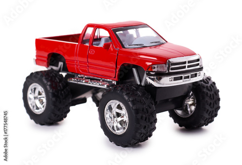 big metal red toy car offroad with monster wheels isolated on white background photo