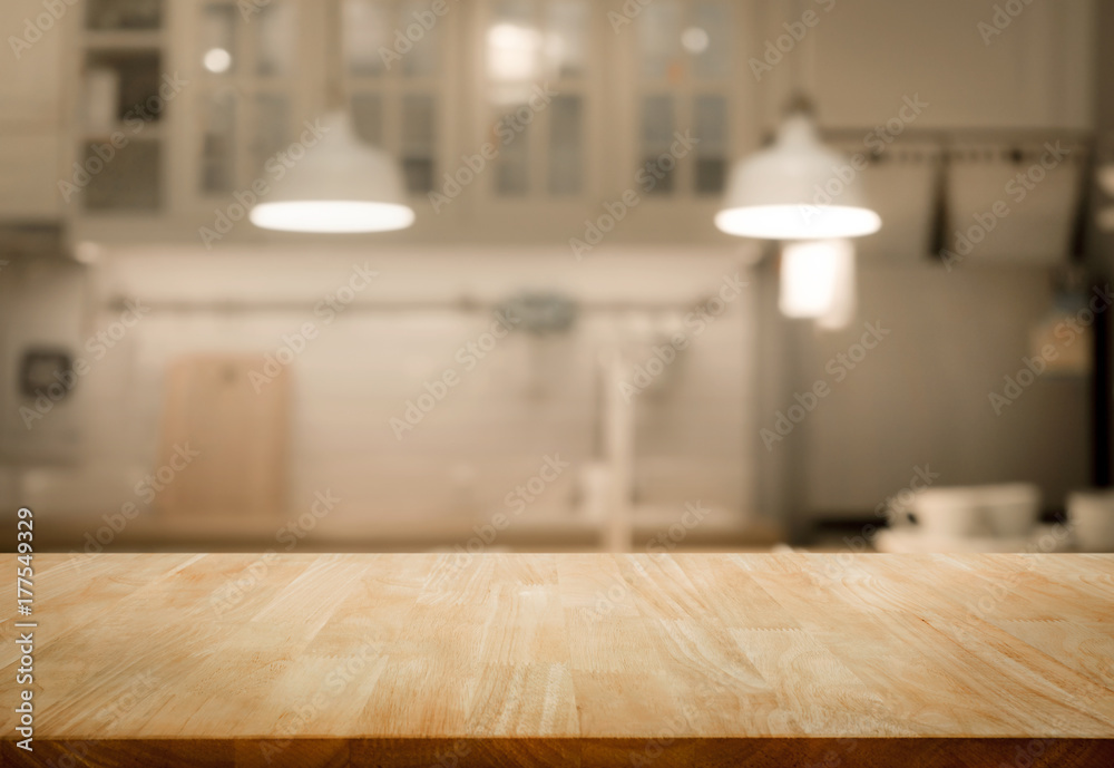 Wood table top on blur kitchen room background .For montage product