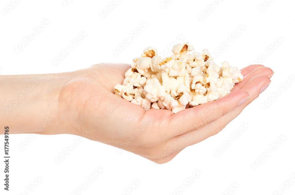 fresh pop corn in hand isolated on white background