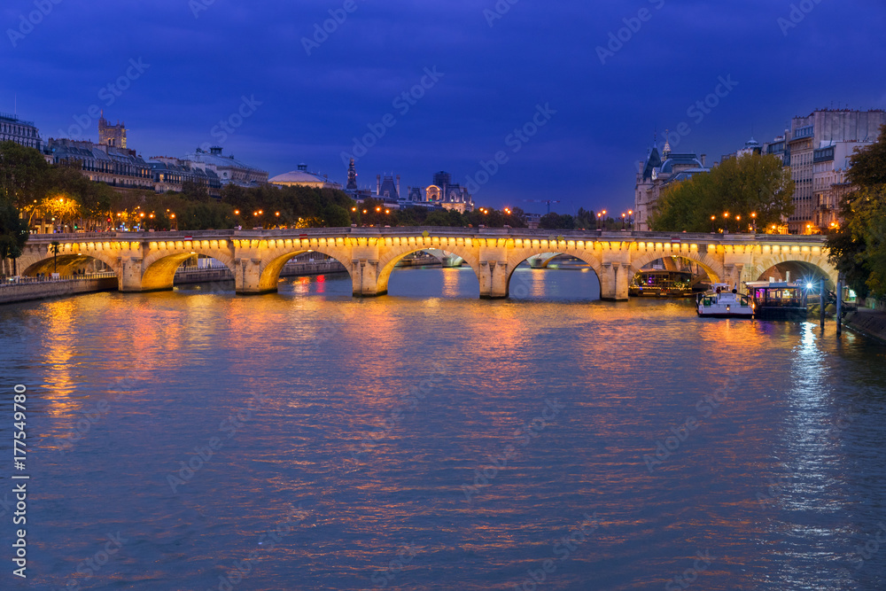 Pont Neuf and river Seine waters at night, Paris, France
