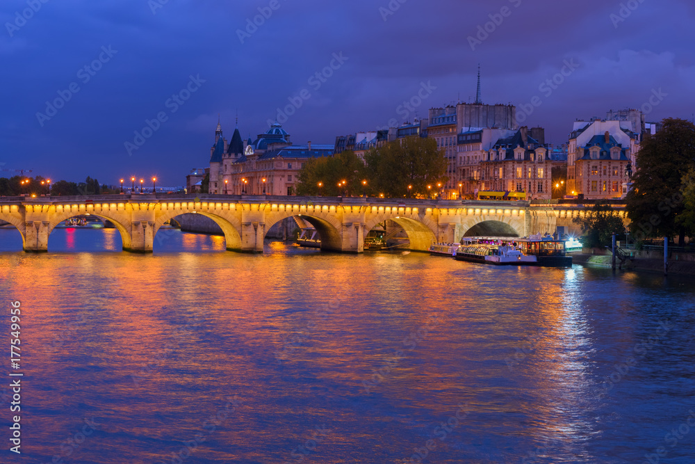 Pont Neuf and Cite island over Seine at night, Paris, France