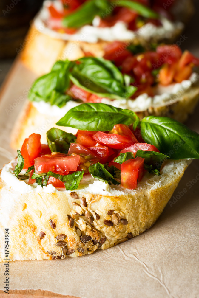 Tomato and cheese fresh made bruschetta. Italian tapas, antipasti with vegetables, herbs and oil on grilled ciabatta and baguette bread. Tomato and cheese fresh made bruschetta. Italian tapas, antipasti with vegetables, herbs and oil on grilled ciabatta and baguette bread.