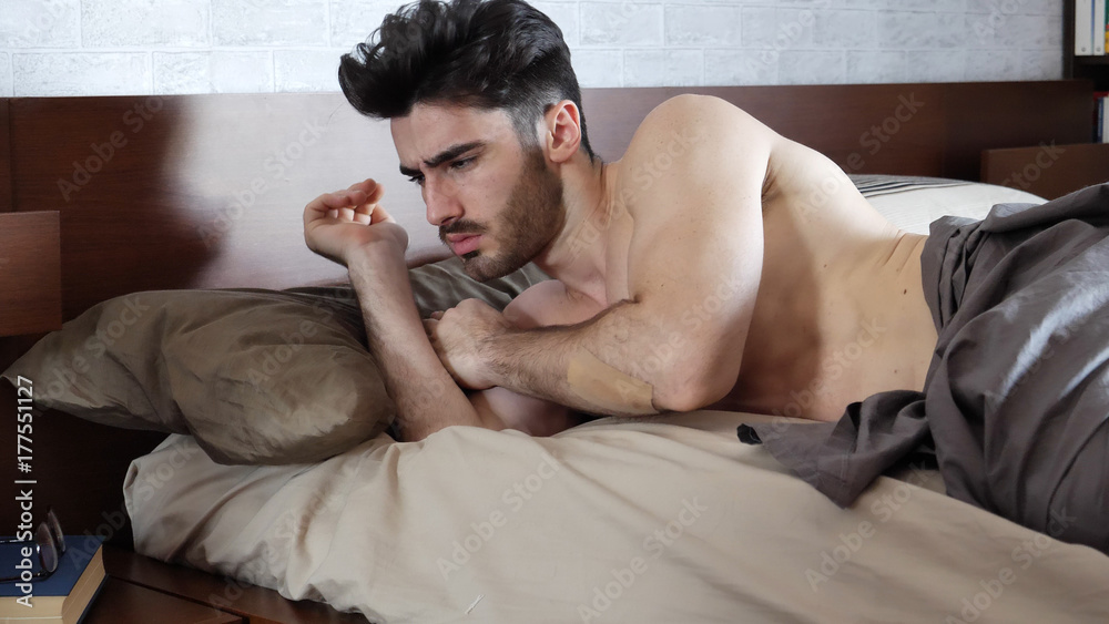 Young Sleepy Man, Lying in Bed Waking Up Young Sleepy Man, Lying in Bed Waking Up