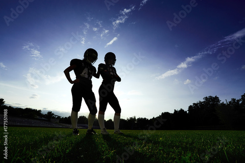 Fototapeta Naklejka Na Ścianę i Meble -  Women players in American football are on the field.
