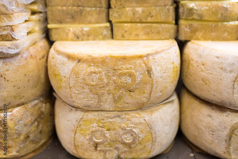 Big loaf of yellow cheese in a market Big loaf of yellow cheese in a market
