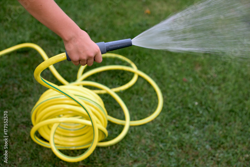 Yellow pastic hose pipe photo