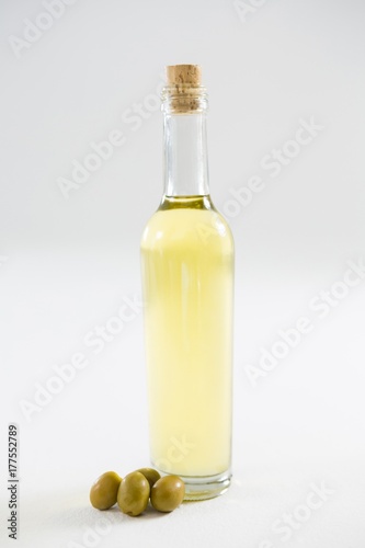 Green olive oil in bottle