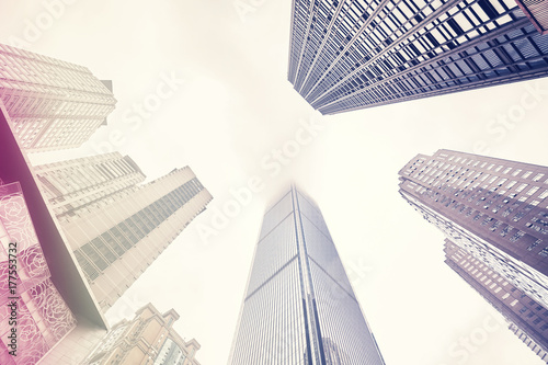 Looking up at skyscrapers in clouds  color toning applied  Chongqing  China.