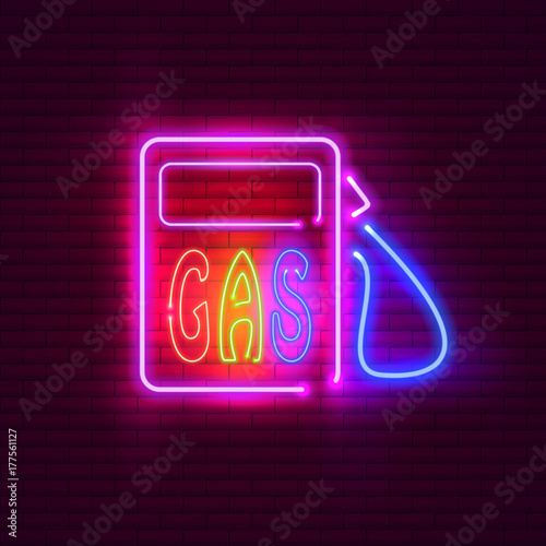 Gas station neon sign on brick wall. Vintage signboard