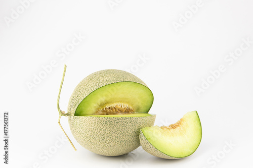 Green melon slice on white isolated background